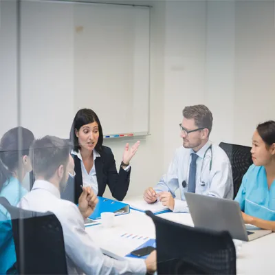 Healthcare professional discussing with a patient about clinical trial options