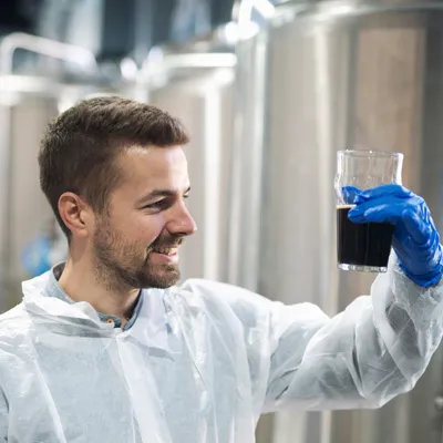  Researchers in a bioprocess lab analyzing design space and quality attributes