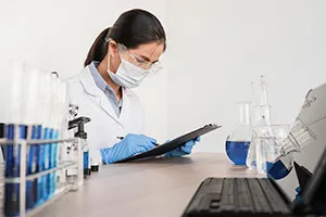 Laboratory technicians calibrating sensors in a bioreactor system