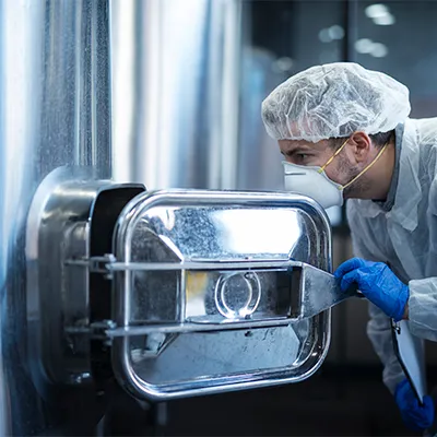 Laboratory technician monitoring sterile aseptic fill process