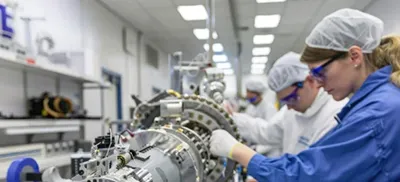Controlled cleanroom environment with personnel wearing PPE