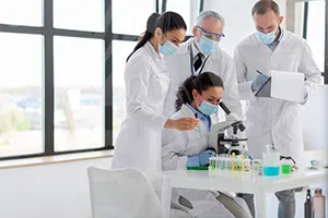 Scientists working together in a high-tech lab emphasizing global pharma innovation