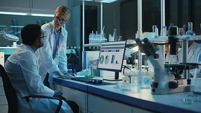 Regulatory affairs team reviewing pharma compliance documentation